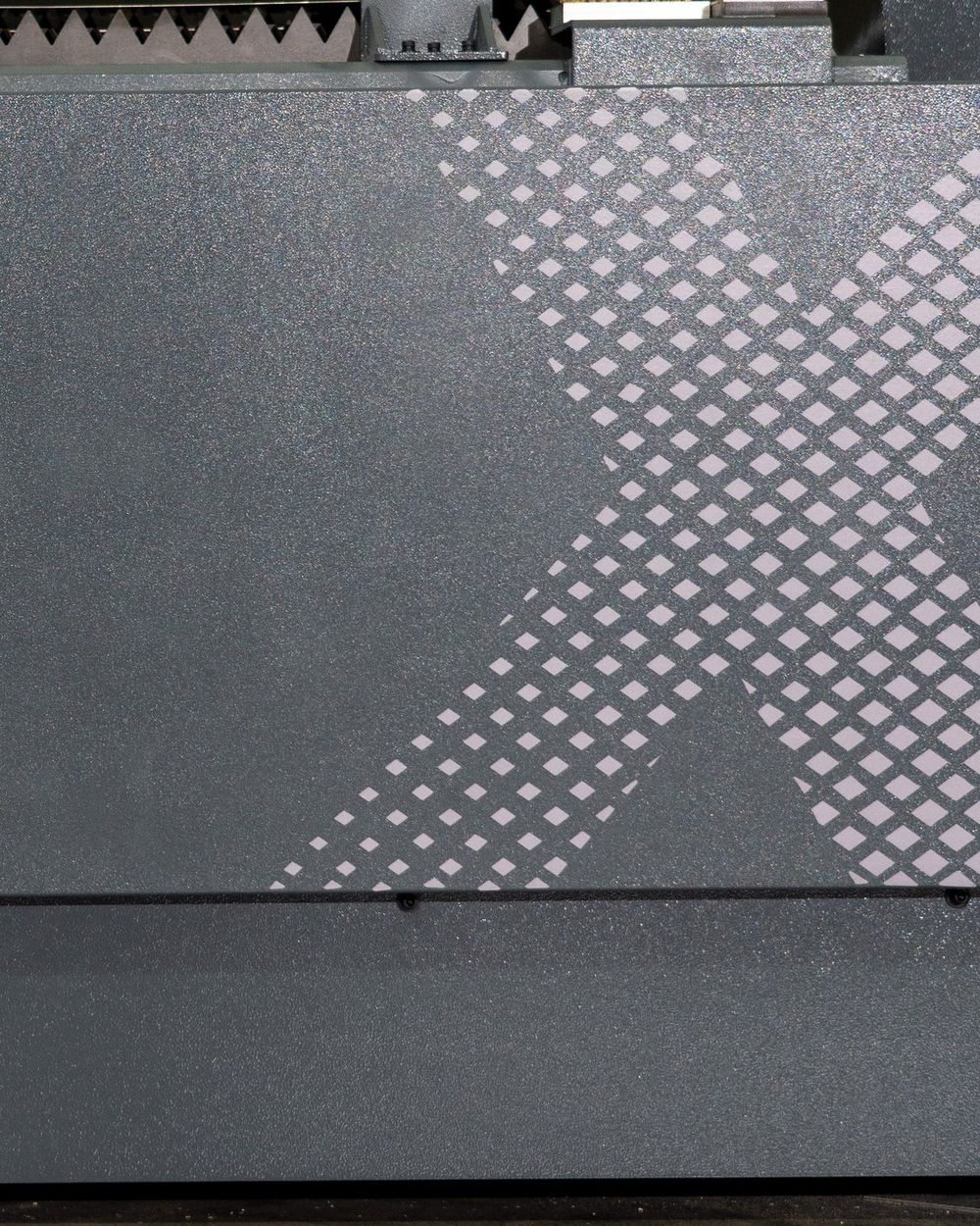 The X cut into the front panel of a SMART Compact X